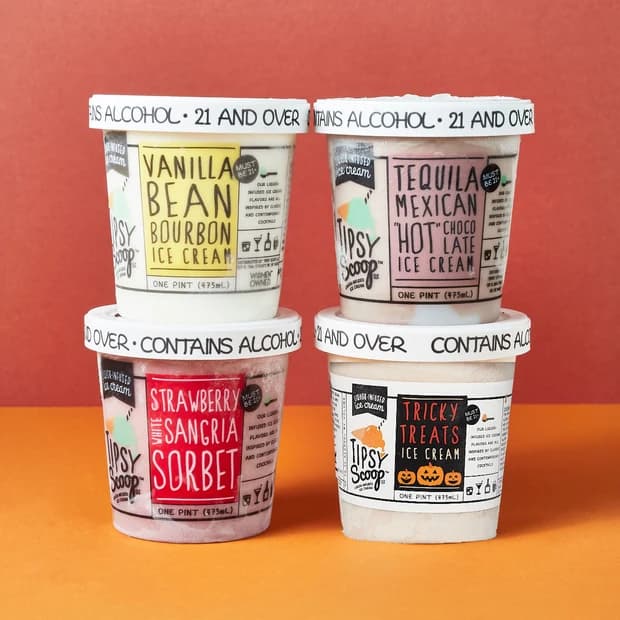 Four pints of Tipsy Scoop liquor-infused ice cream and sorbet on a dual-tone background