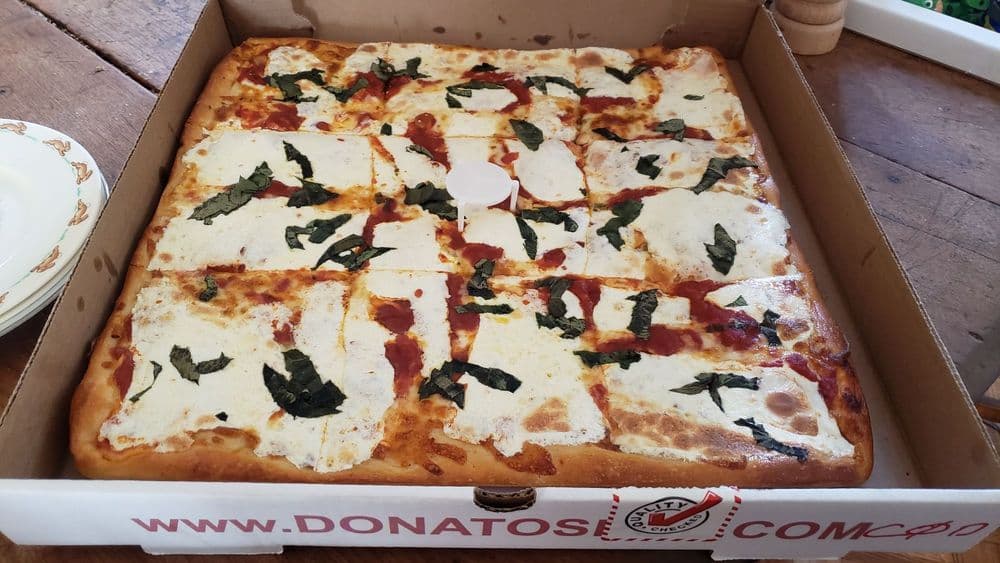 Donato's Italian Restaurant grandma style pizza with fresh basil in Woodside Queens
