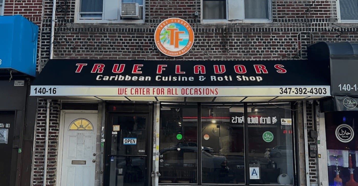 True Flavors Caribbean Cuisine & Roti Shop storefront on Liberty Ave in Ozone Park, a halal roti spot near Terp Bros